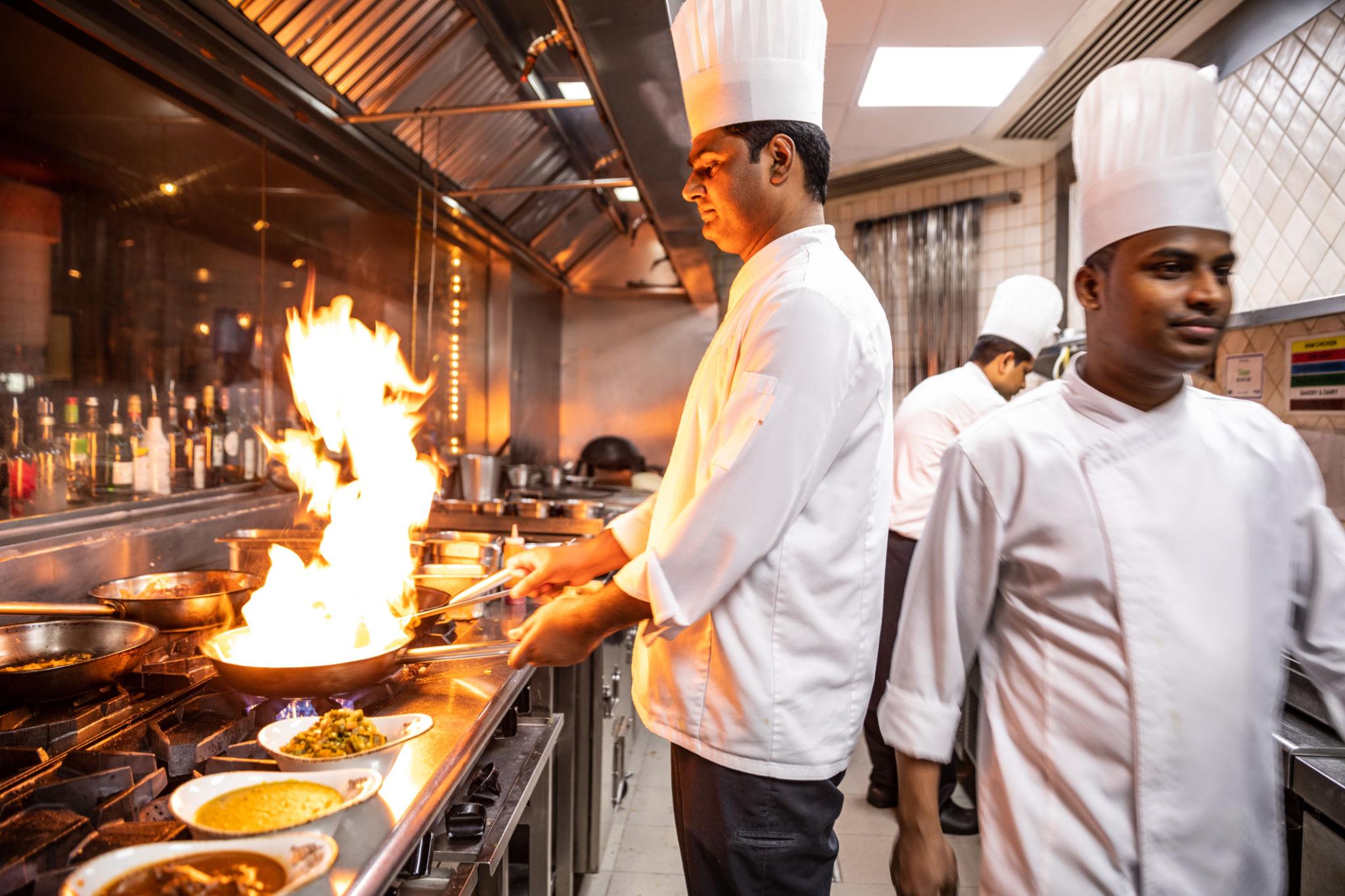 Chefs at work in a restaurant kitchen